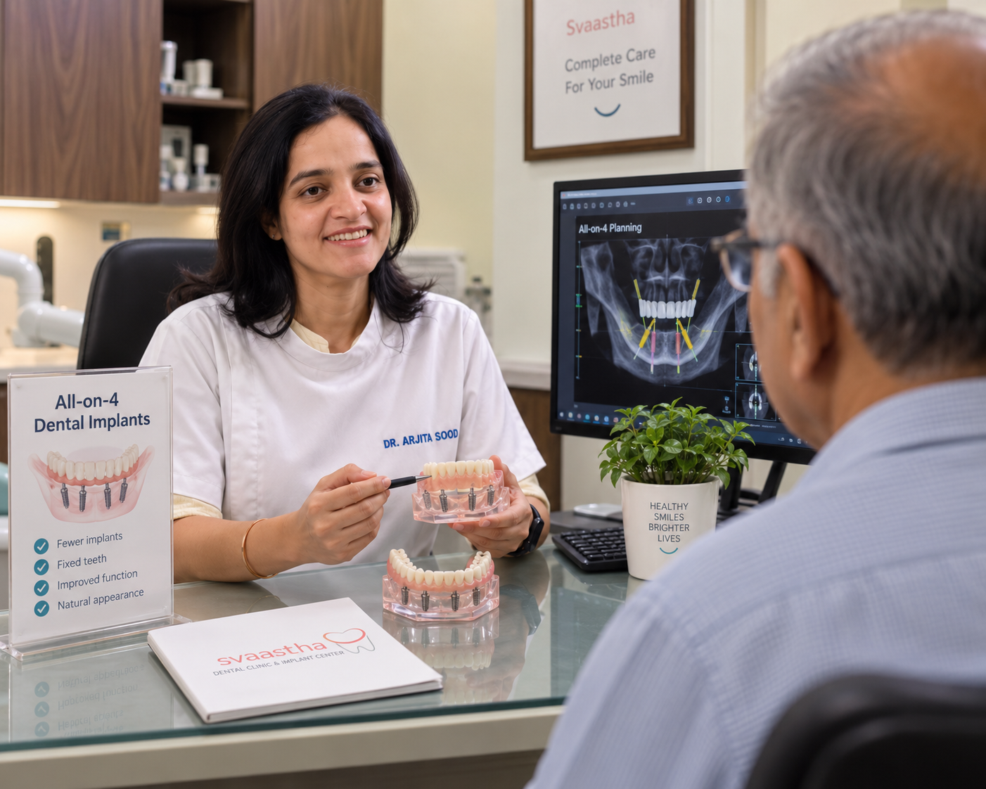 Dr. Arjita Sood discussing full-mouth dental implant treatment with a patient in Gurgaon